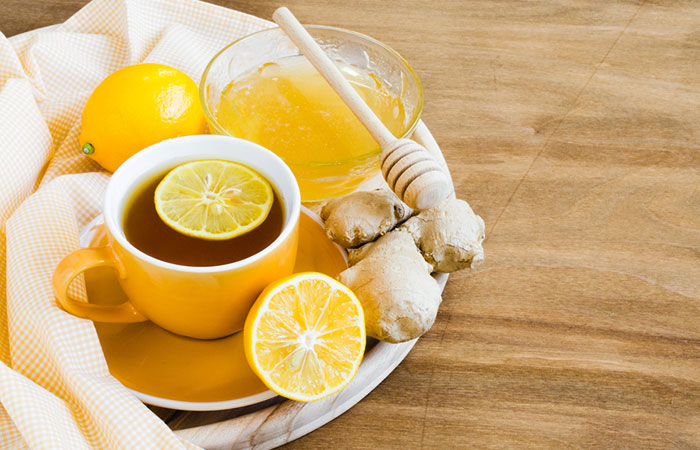 A cup of ginger water with honey to heal body pain