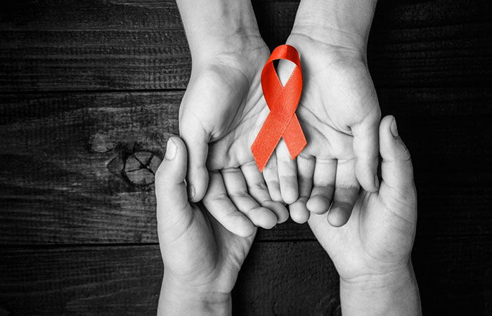 AIDS ribbon in hands