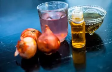 Coconut oil and onion juice for dandruff