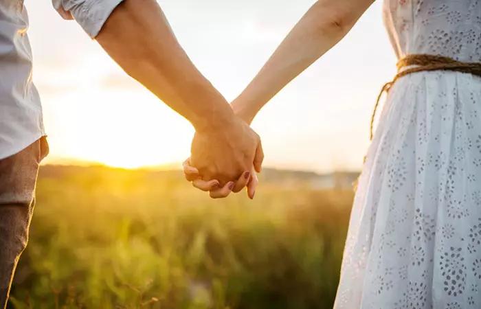 Couple holding hands showing Aries and Cancer Relationship Compatibility