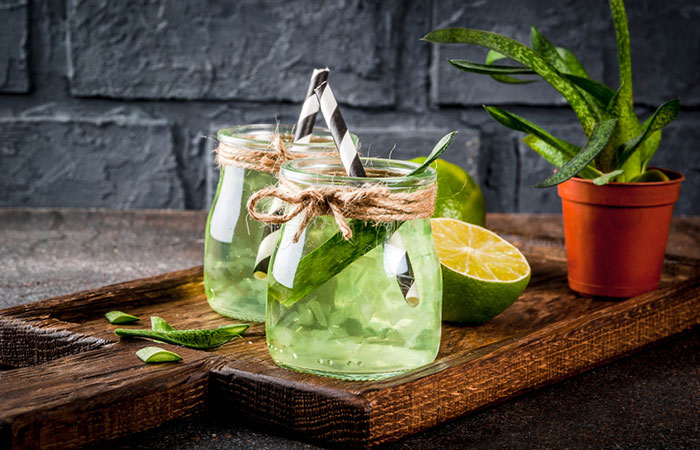 Jar of Aloe vera gel and lemon placed for hair growth.