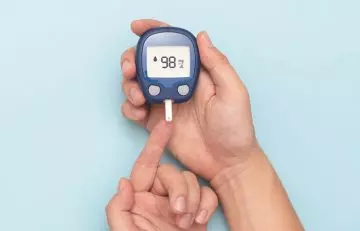 Person checking blood sugar level 