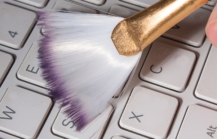 Use A Brush To Remove Dust Off Your Keyboard