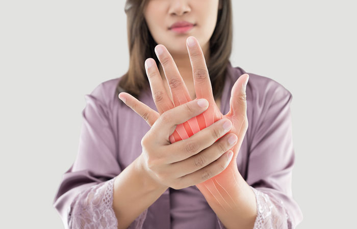 Woman dealing with arthritis that can be managed with Niacin