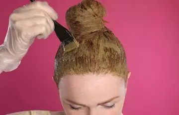 Woman dyeing her hair