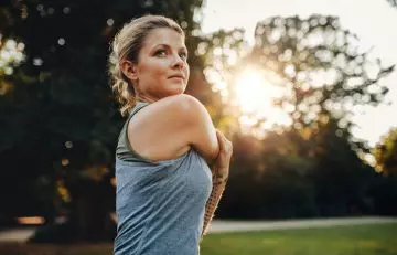 Woman exercising to stay healthy and get glowing skin