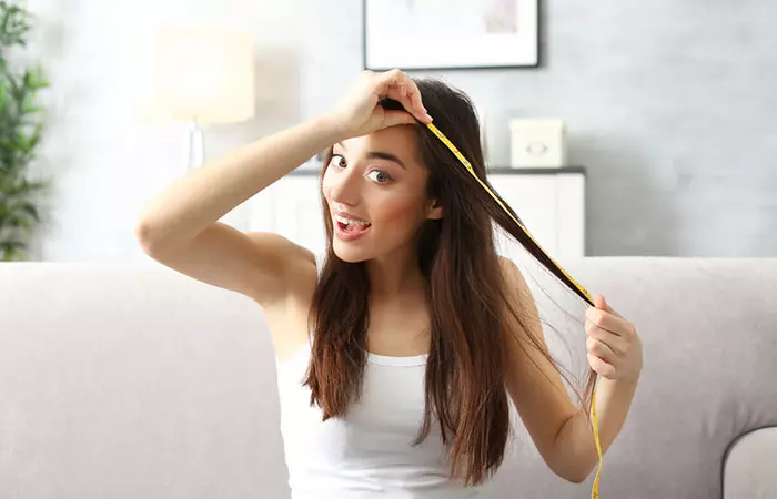 Woman experiencing hair growth after using hyaluronic acid 