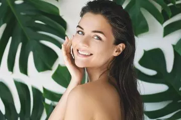 Woman happy with moisturized skin
