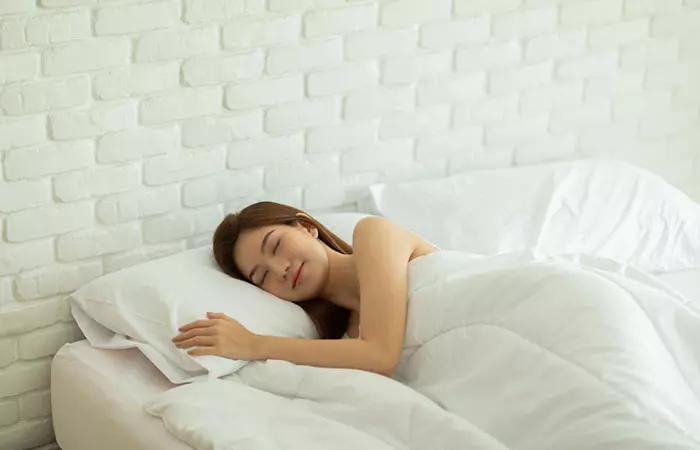 Woman having sound sleep to flush kidneys naturally