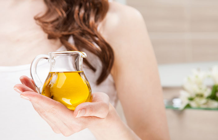 Woman holding a jar of sunflower oil