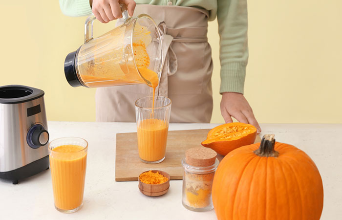 Woman preparing pumpkin juice