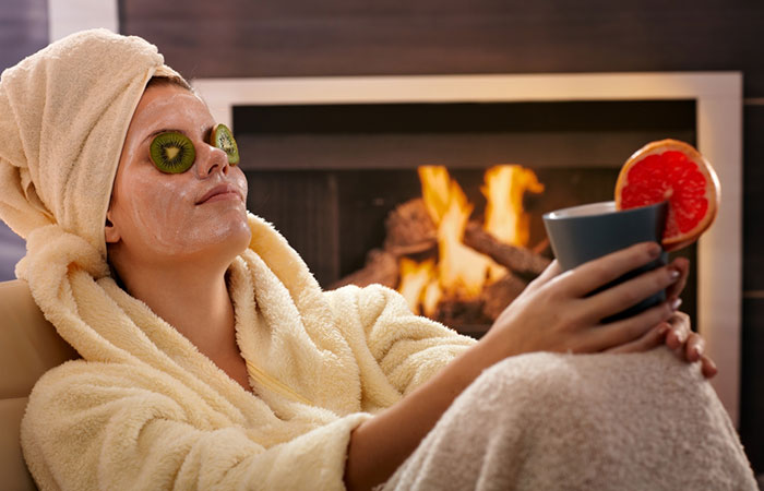 Woman relaxing in green tea face mask