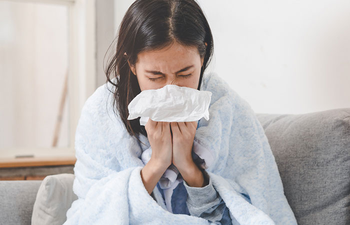 Woman suffering from common cold