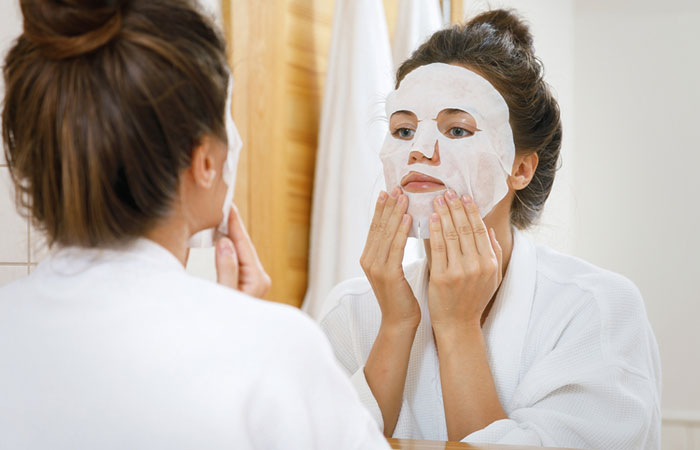 Woman with a face mask as part of the French skincare routine