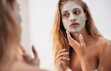 Woman with a facial mask to improve skin health