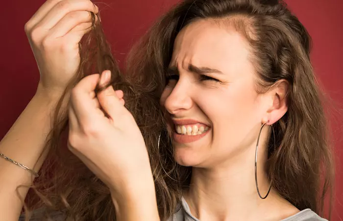 Woman with hair damage due to excessive use of mousse