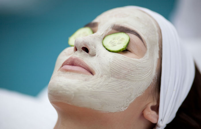 Woman with oats and cucumber face mask