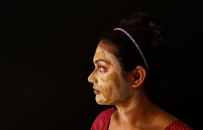 Woman with sandalwood face mask