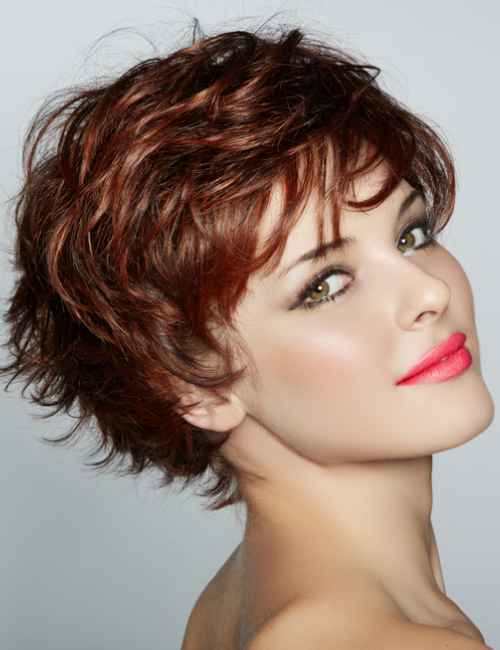 Mahogany-colored choppy pixie haircut with soft highlights
