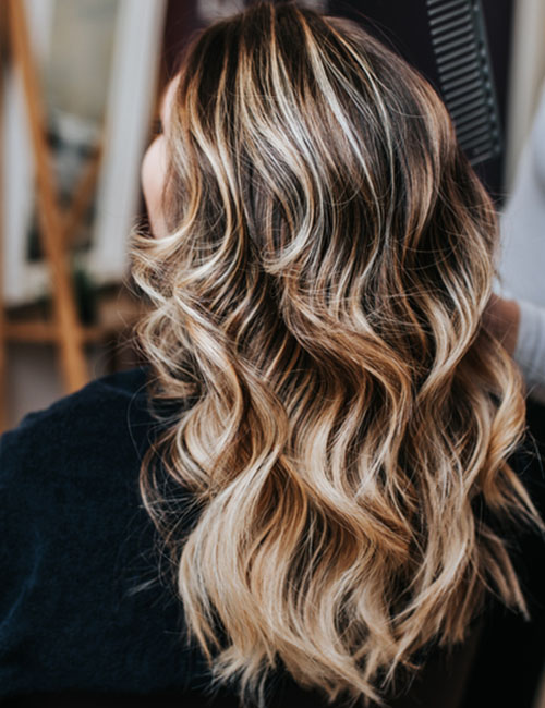 Dirty blonde balayage hairstyle for black hair