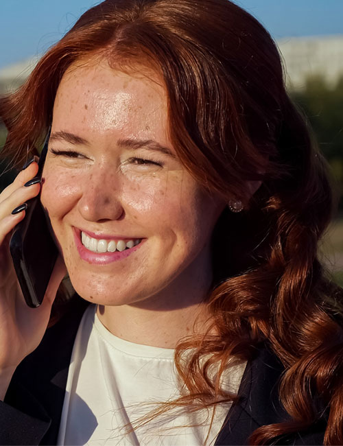 A woman in faded copper hair color