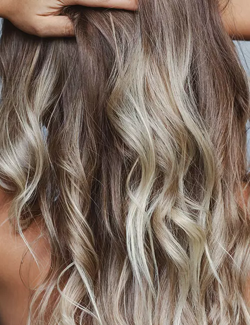 Icy blonde balayage hairstyle for thick hair
