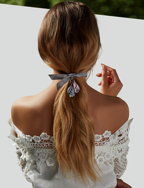 Low bow messy ponytail