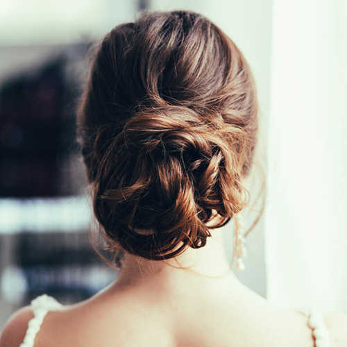 Woman sporting a twisted bun hairstyle