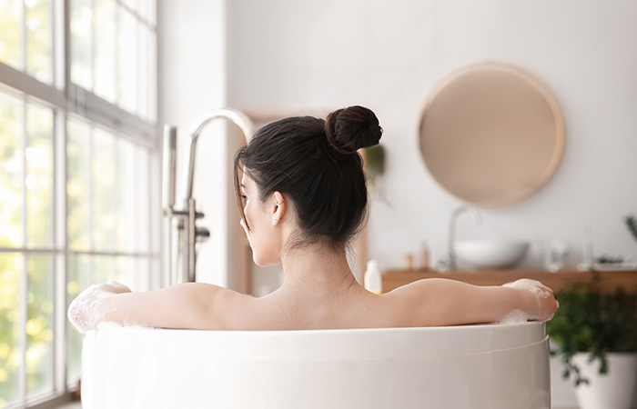 A woman relaxing in a bathtub