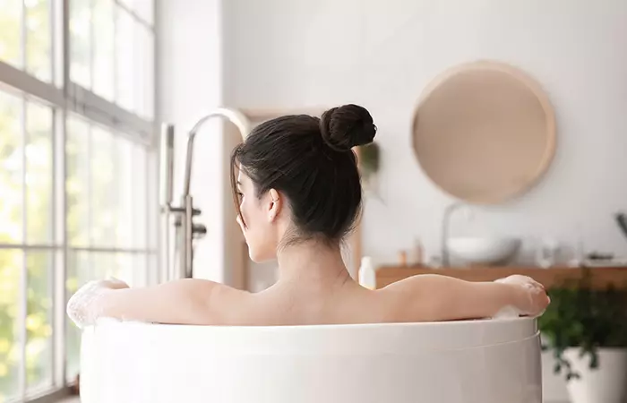 A woman relaxing in a bathtub