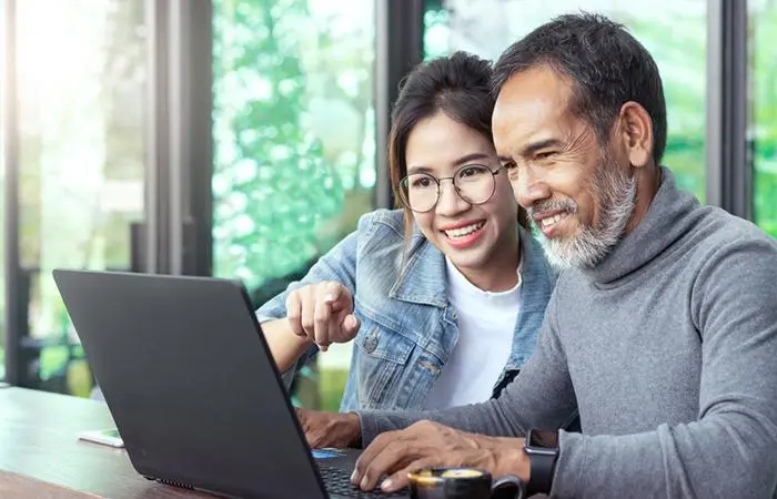 An young Asian woman with an older man