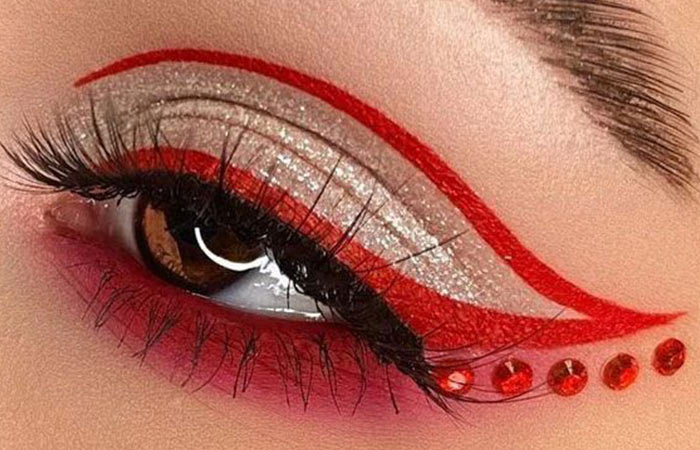Cardinal red eyeshadow look with face gems