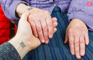 Close up of two pairs of hands with roman numerals wrist mother son tattoo