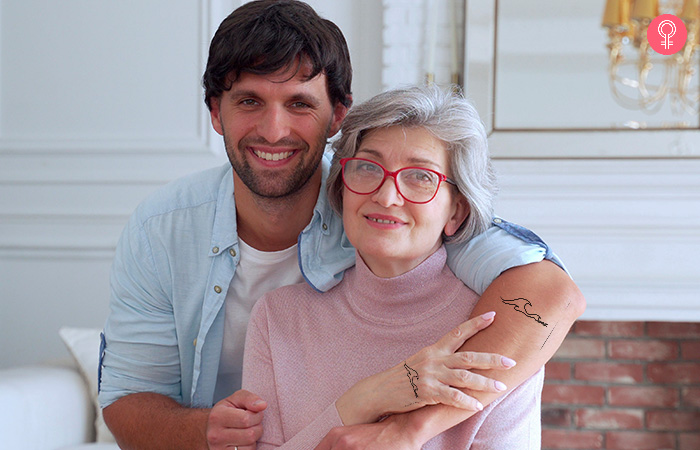 Embracing mother and son with ocean wave line art for mother son tattoos