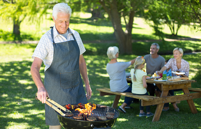 Grandfather enjoying a barbecue party