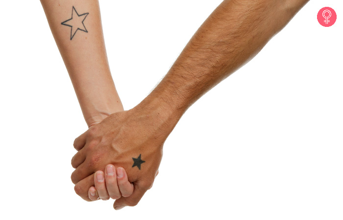 Hands with minimal stars as mother son tattoo