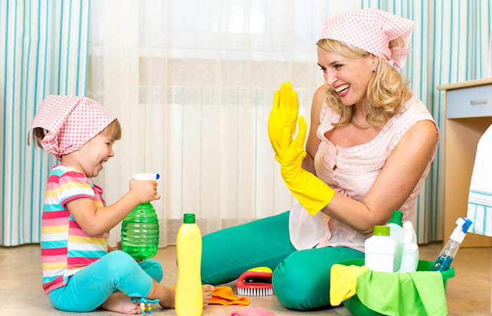 Mother and child cleaning together
