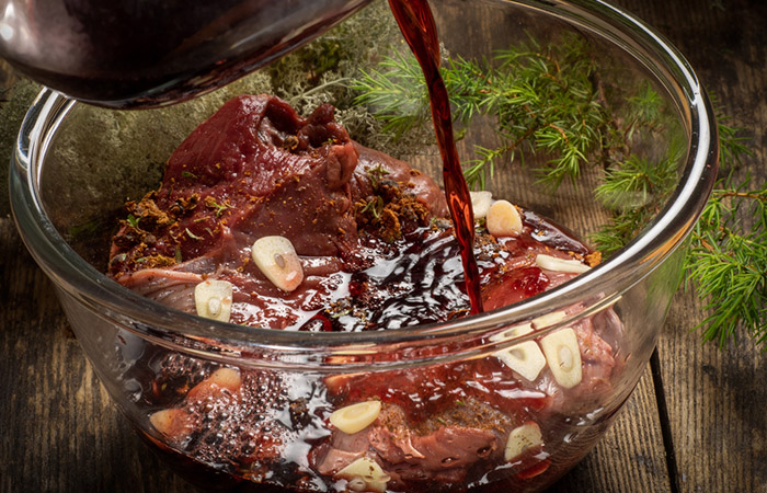 Meat marination with vegetable oil, red wine, and spices.