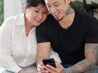 Mother and son checking out tattoo designs on a smartphone