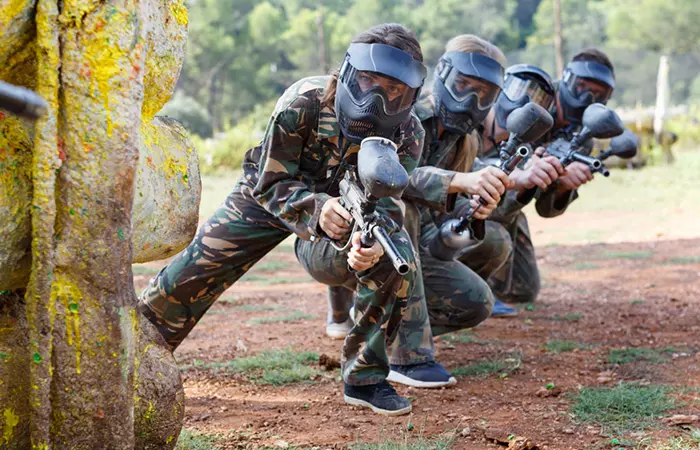 A Paintball Team Waitin For Their Target