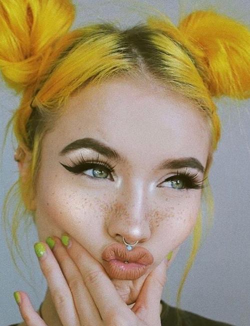 Space buns on yellow hair