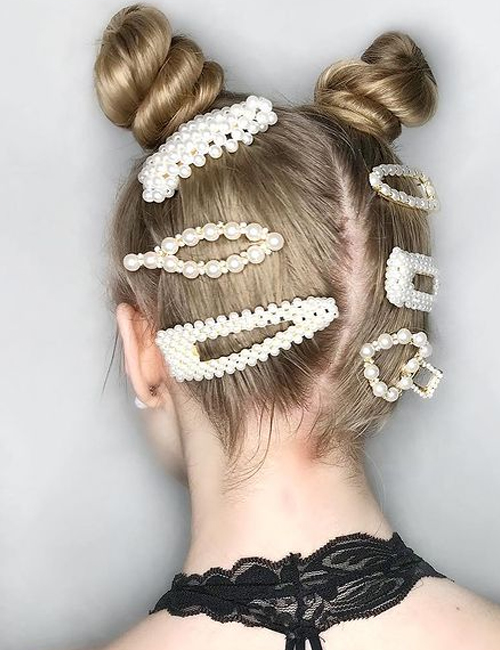 Twisted space buns with pearl accessories