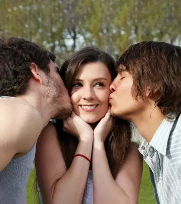 Two men kissing a girl in an open relationship