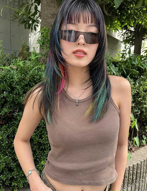 Wolf cut hairstyle with layers and rainbow-colored streaks