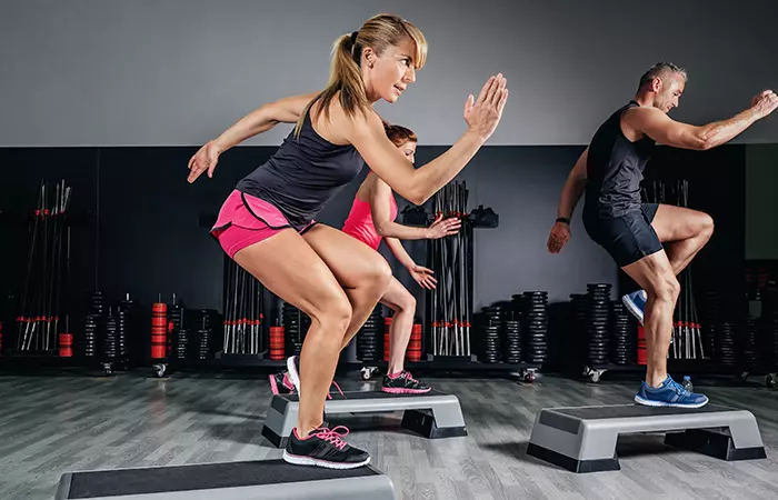 Woman doing step ups to strengthen her quads