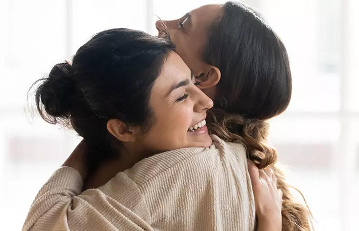 Woman hugging her sister-in-law on her birthday
