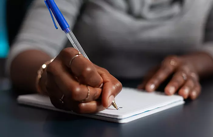 Woman writing thank you messages 