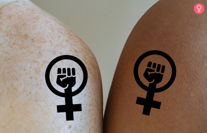 close up of feminist symbols on shoulders for matching mother son tattoos