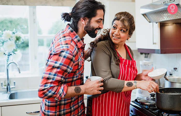 mother and son cooking in the kitchen sporting mandala mother son tattoo (2)