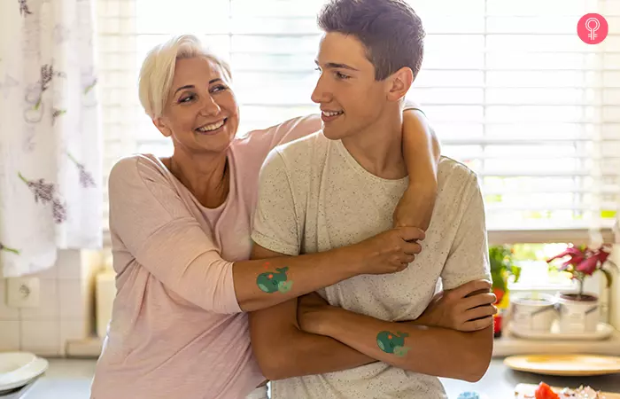 mother and son in the kitchen posing with their momma and baby whale mother son tattoos